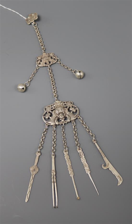 A Chinese white metal pendant on chain